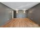 Spacious bedroom with hardwood floors and modern gray walls at 705 Mcalway Rd, Charlotte, NC 28211