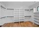 Large walk-in closet with ample shelving and hanging space at 705 Mcalway Rd, Charlotte, NC 28211