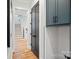 Hallway showcasing hardwood floors, a staircase, and dark stained doors at 705 Mcalway Rd, Charlotte, NC 28211