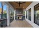 Relaxing outdoor patio with fireplace and wooden deck at 705 Mcalway Rd, Charlotte, NC 28211