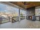 Relaxing outdoor patio with fireplace and wooden deck at 705 Mcalway Rd, Charlotte, NC 28211