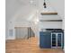 Modern wet bar with dark blue cabinetry and marble countertop at 705 Mcalway Rd, Charlotte, NC 28211