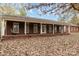 Brick home with covered porch and mature trees at 2830 Sparrow Springs Rd, Gastonia, NC 28052