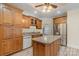 Spacious kitchen featuring an island, stainless steel appliances, and ample wood cabinetry at 2830 Sparrow Springs Rd, Gastonia, NC 28052