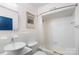 Clean bathroom with a tub, shower, and updated vanity at 400 Queens Rd # E5, Charlotte, NC 28207
