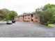 Brick apartment building with parking in front at 400 Queens Rd # E5, Charlotte, NC 28207