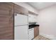 Modern kitchen with wood cabinets and stainless steel appliances at 400 Queens Rd # E5, Charlotte, NC 28207