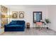 Living room with blue sofa and work area; view of bedroom at 400 Queens Rd # E5, Charlotte, NC 28207