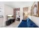 Living room with blue sofa and view of bedroom and kitchen at 400 Queens Rd # E5, Charlotte, NC 28207