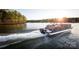 Gathering enjoys a pontoon boat ride at sunset at 4375 Reed Creek Dr, Sherrills Ford, NC 28673