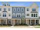 Two-story townhouses with gray siding, stone accents, and landscaping at 7109 Brookview Ln, Sherrills Ford, NC 28673
