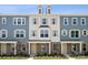 Three-unit townhome building with neutral siding, shutters, and landscaping at 7113 Brookview Ln, Sherrills Ford, NC 28673