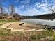 Relaxing lakefront view with fire pit and tranquil landscaping at 7121 Brookview Ln, Sherrills Ford, NC 28673