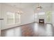 Living room with hardwood floors, fireplace, and sliding glass doors to patio at 105 Beverly Chase Ln, Mooresville, NC 28117