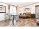 Bright dining area with a table and chairs, hardwood floors, and a couch at 1131 Colonial Rd, Clover, SC 29710