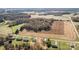 Aerial view of a large land plot with nearby houses and open fields at 1244 Bob Falls Rd, Shelby, NC 28150