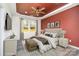 Spacious bedroom with a red accent wall and plenty of natural light at 1244 Bob Falls Rd, Shelby, NC 28150