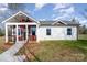 Newly built home with red and white siding, a covered porch and walkway at 1244 Bob Falls Rd, Shelby, NC 28150