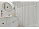 Small bathroom with white vanity, shower/tub combo, and nautical decor at 191 Oak Village Pkwy, Mooresville, NC 28117