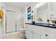 Bathroom with white vanity, dark countertop, and walk-in shower at 191 Oak Village Pkwy, Mooresville, NC 28117