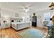 Main bedroom with king-size bed, hardwood floors, and a ceiling fan at 191 Oak Village Pkwy, Mooresville, NC 28117