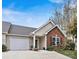 Front view of charming brick and siding home with landscaping at 191 Oak Village Pkwy, Mooresville, NC 28117