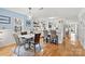 Kitchen with white cabinets, island, and dining area at 191 Oak Village Pkwy, Mooresville, NC 28117