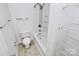 Clean bathroom with tub and shower, plus shelving at 2030 Cambridge Beltway Dr, Charlotte, NC 28273