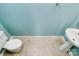 Small bathroom with pedestal sink and light blue walls at 2030 Cambridge Beltway Dr, Charlotte, NC 28273