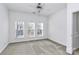 Spacious bedroom with three windows and ceiling fan at 2030 Cambridge Beltway Dr, Charlotte, NC 28273