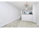 Bright dining room with chandelier and kitchen access at 2030 Cambridge Beltway Dr, Charlotte, NC 28273