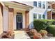 Front entrance of townhome with blue door and brick columns at 2030 Cambridge Beltway Dr, Charlotte, NC 28273