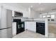 Modern kitchen with stainless steel appliances and white cabinets at 2030 Cambridge Beltway Dr, Charlotte, NC 28273