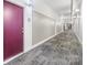 Building hallway with carpet and neutral walls at 2125 Southend Dr # 349, Charlotte, NC 28203