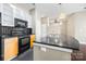 Modern kitchen with black appliances and wood cabinets at 2125 Southend Dr # 349, Charlotte, NC 28203