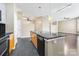 Open kitchen with island and dark countertops at 2125 Southend Dr # 349, Charlotte, NC 28203