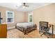 Bedroom with ceiling fan, natural light, and laminate flooring, plus a desk area for working or studying at 2401 Boy Scout Rd, Lincolnton, NC 28092