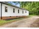 White home showcasing the side and roof, surrounded by well-maintained landscaping at 2401 Boy Scout Rd, Lincolnton, NC 28092