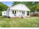 Inviting single-story home featuring a covered front porch and well-manicured lawn at 2401 Boy Scout Rd, Lincolnton, NC 28092