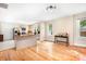 Spacious living room featuring hardwood floors, a kitchen island, and abundant natural light at 2401 Boy Scout Rd, Lincolnton, NC 28092