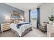 Serene bedroom features an accent wall, plush carpet, and a window with a pleasant view at 2561 Blue Sky Meadows Dr, Monroe, NC 28110