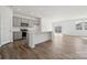 Modern kitchen featuring gray cabinets, a center island, and stainless steel appliances at 2561 Blue Sky Meadows Dr, Monroe, NC 28110