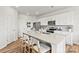 Bright kitchen featuring white cabinets, quartz countertops, and a large center island at 2565 Blue Sky Meadows Dr, Monroe, NC 28110