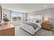 Serene main bedroom with a large window, soft lighting, and contemporary decor at 2565 Blue Sky Meadows Dr, Monroe, NC 28110