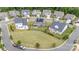 A beautiful aerial view of a modern home with a spacious yard and solar panels in a well-maintained neighborhood at 3029 Quinebaug Rd, Fort Mill, SC 29715