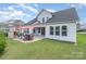 This backyard is fenced in and features a patio with a fireplace and a grill at 3029 Quinebaug Rd, Fort Mill, SC 29715