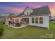 This backyard is fenced in and features a patio with a fireplace and a grill at 3029 Quinebaug Rd, Fort Mill, SC 29715