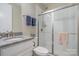 Clean bathroom featuring a vanity with granite countertop, toilet, and a shower with glass doors at 3029 Quinebaug Rd, Fort Mill, SC 29715