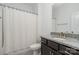 Well-lit bathroom features a shower/tub combo and dark vanity with a granite countertop at 3029 Quinebaug Rd, Fort Mill, SC 29715