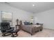 This bedroom has an accent chair, a desk and a queen sized bed at 3029 Quinebaug Rd, Fort Mill, SC 29715